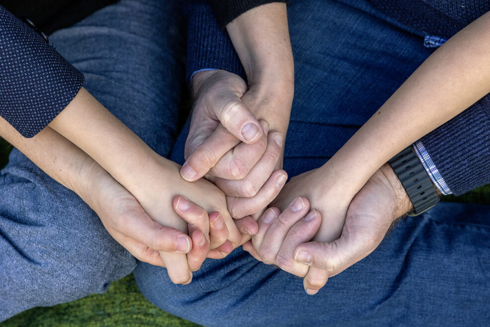 holding hands during a family photo session