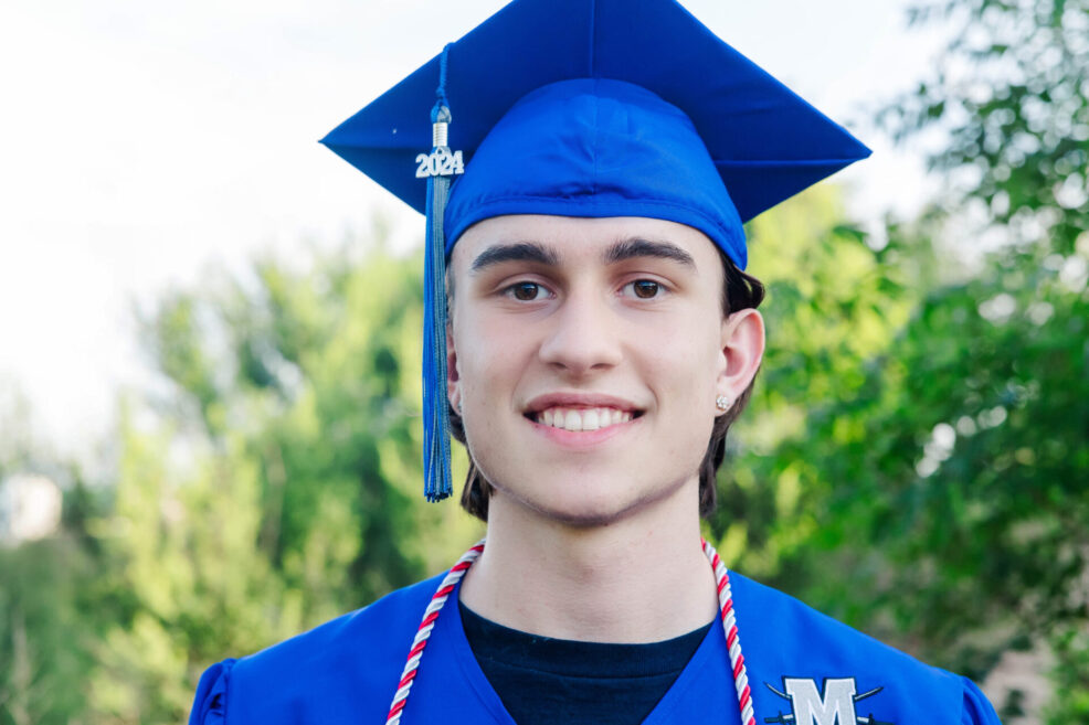 high school senior boy photo session in east austin at the mueller southwest greenway park cap and graduation gown