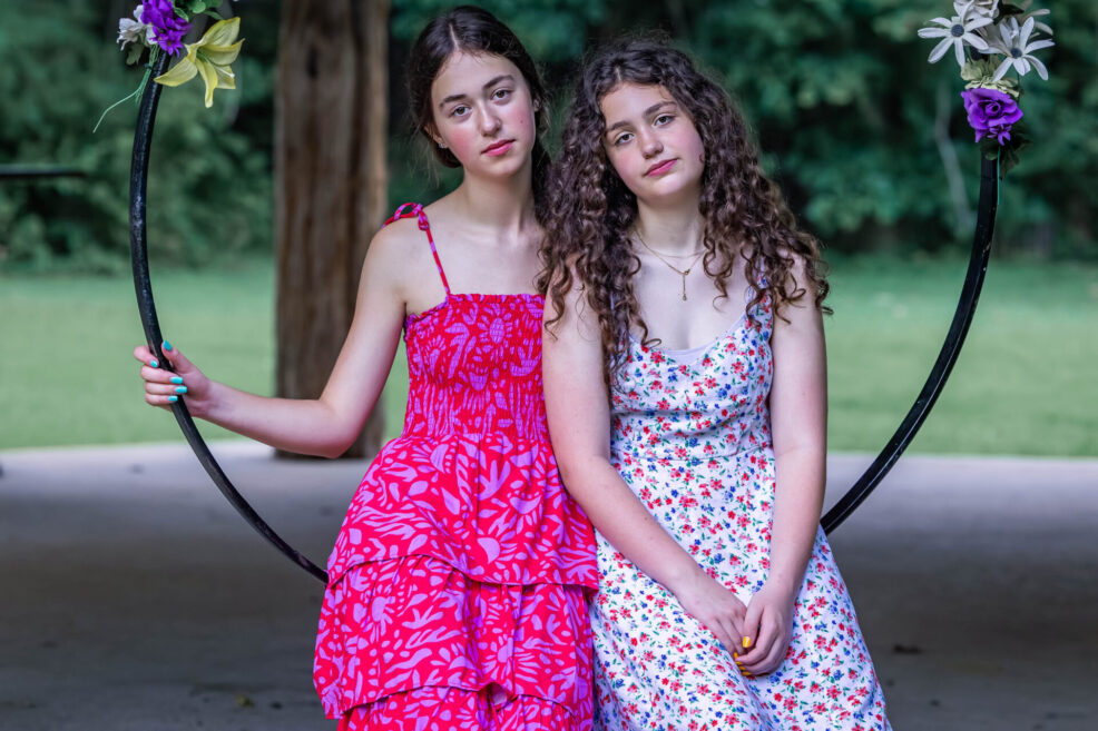 girls in flower swing at east austin art space for photo session with stephanie friedman photography