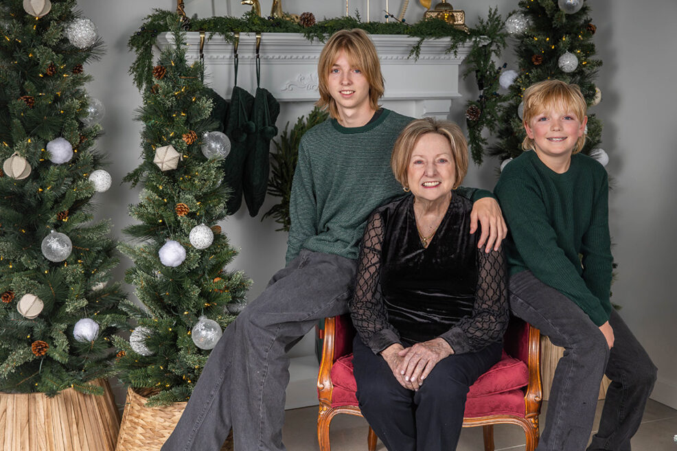 grandmother with two grandsons during family photo session for the christmas holidays