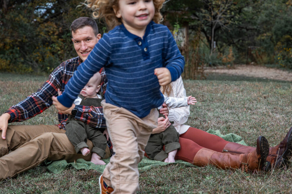 toddler running away at family photo session