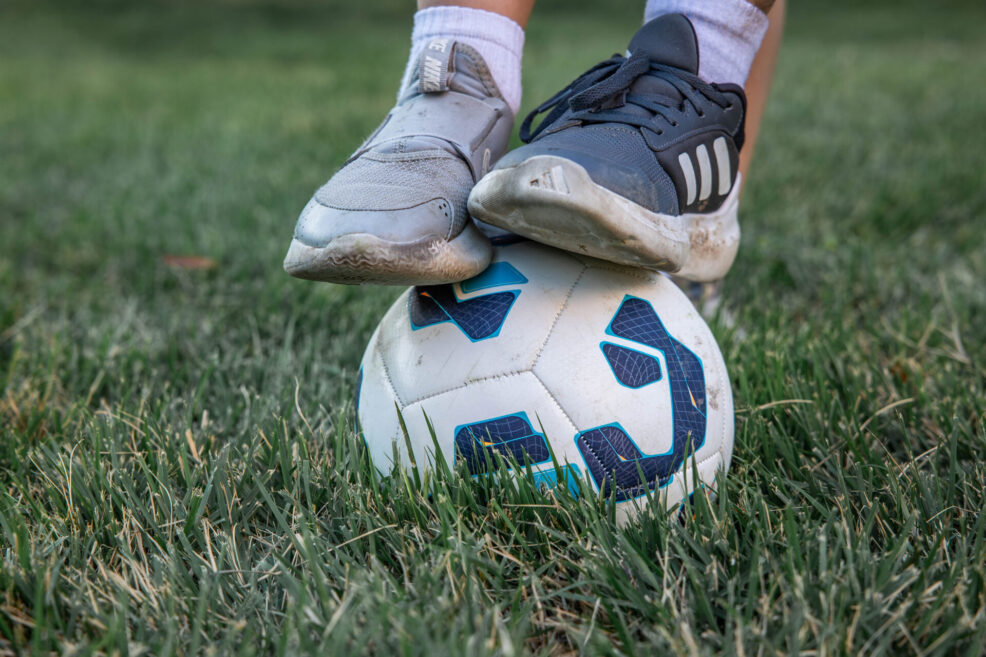 two feet on a soccer ball