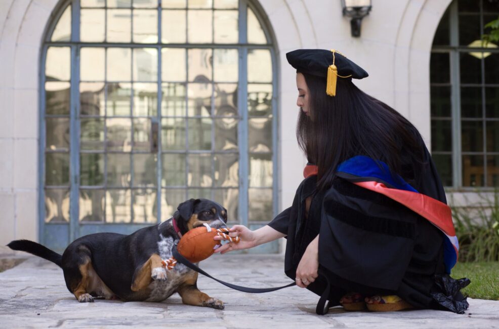 University of Texas college graduation senior with her pet dog