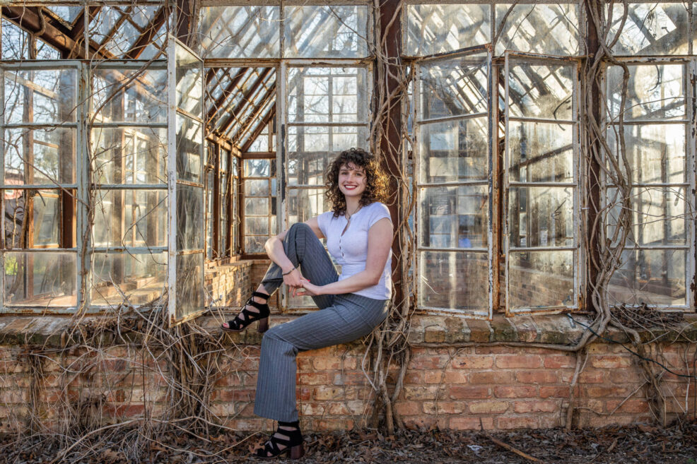 high school senior photo session at the sekrit theater in east austin greenhouse glass